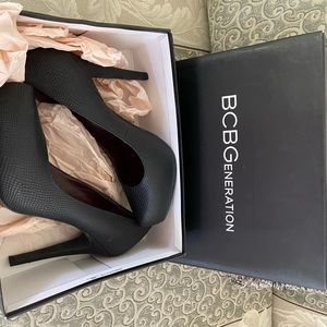 BCBG BLACK RUMBA SNAKE PUMPS